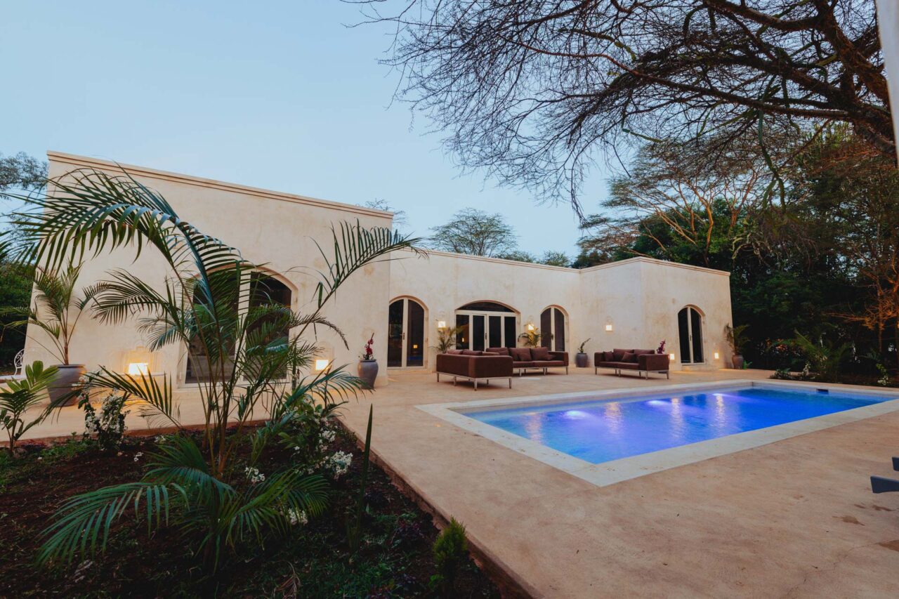 A luxury villa exterior with private pool, Aman-i-Kya, Maasai Mara, Kenya, a moment from a luxury safari holiday.
