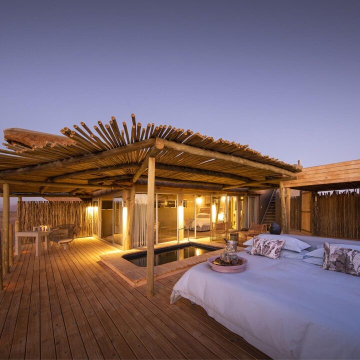 A rooftop deck at dusk at Wilderness Little Kulala, Namibia.